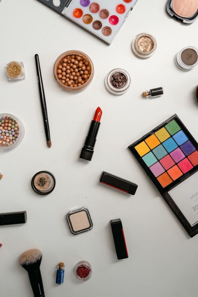 a variety of beauty products on a white surface